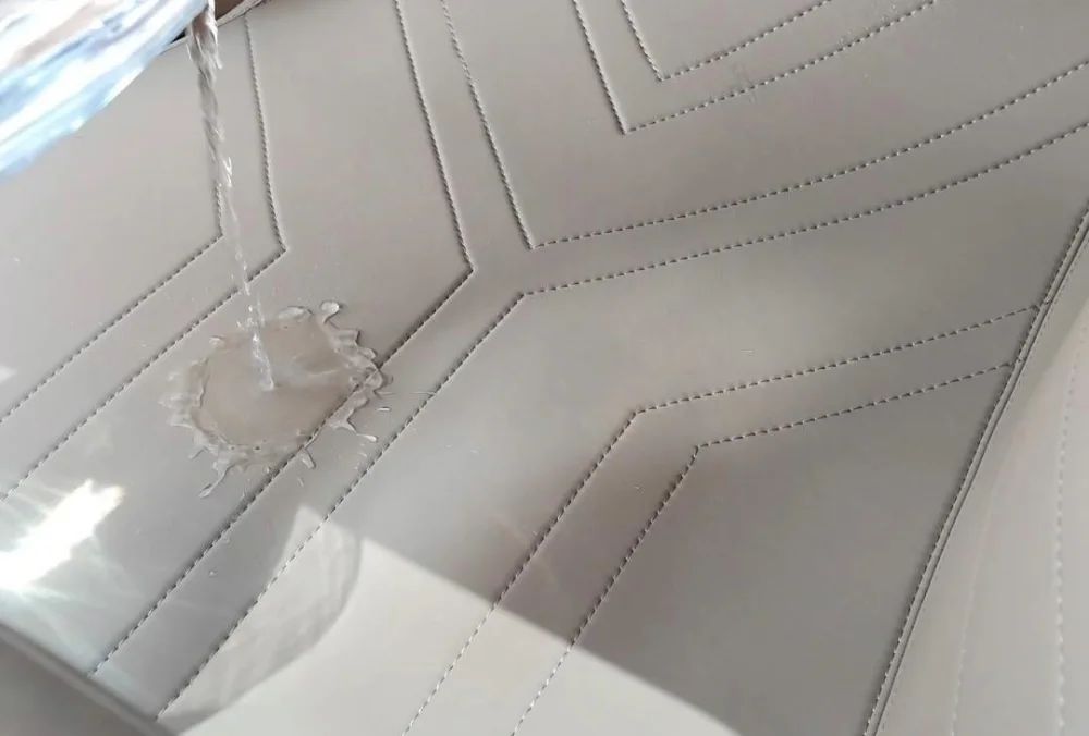 Water beading on the surface of a stitched EZYMAT mat
