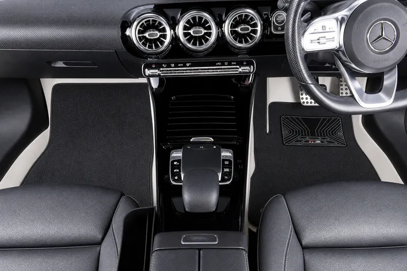 A double-layer EZYMAT mat in a Mercedes-Benz A-Class, with the top layer, the border round it and the heel pad numbered 1, 2 and 3